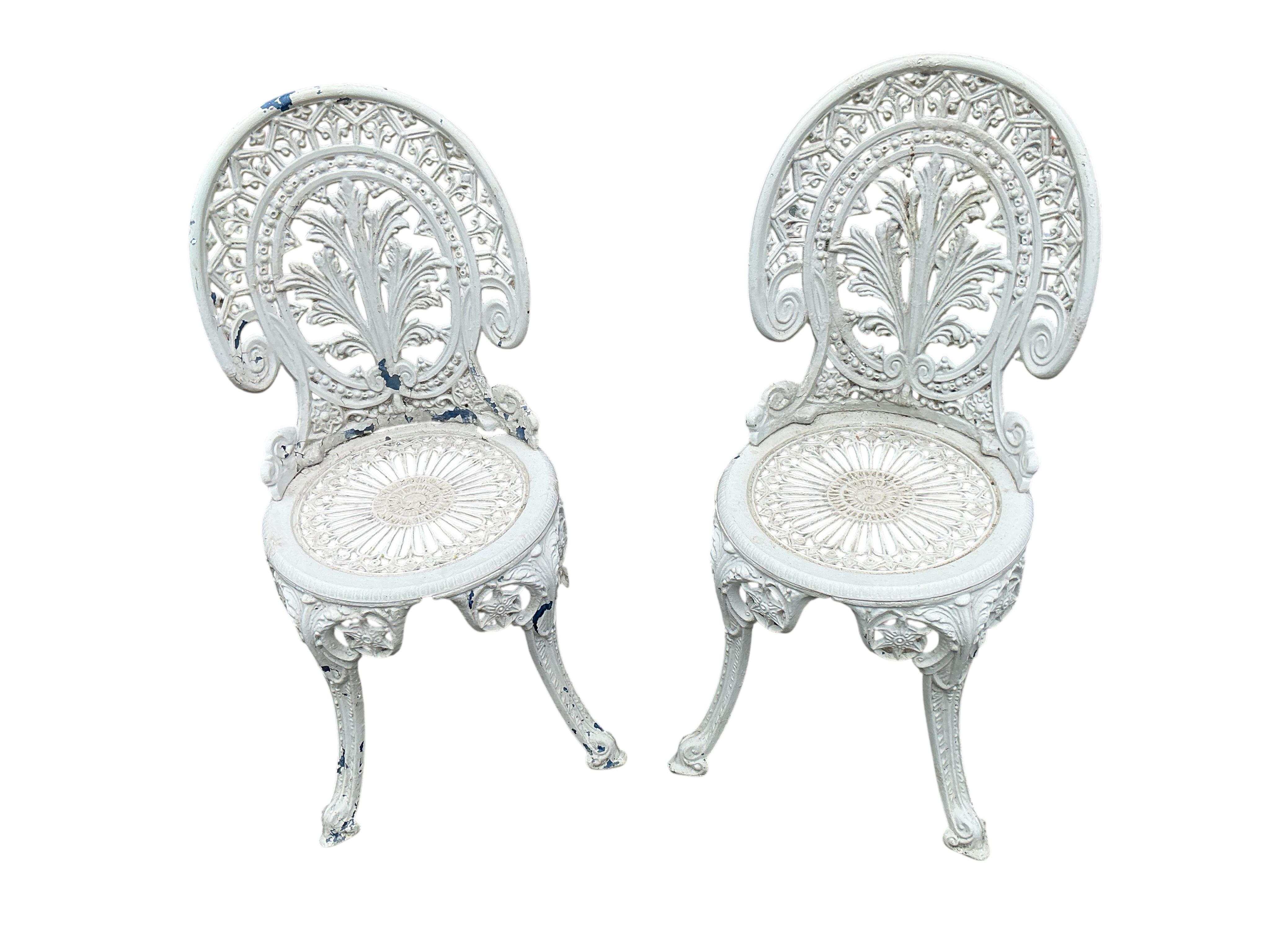 A pair of Victorian style painted aluminium garden chairs, height 85cm
